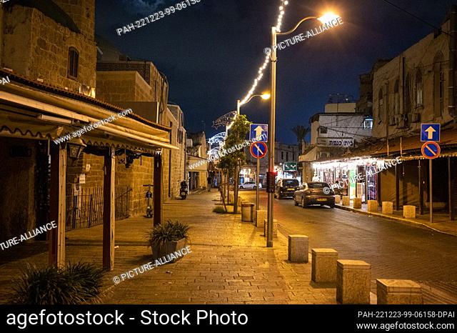 12 September 2022, Israel, Tel Aviv: Streetlights shine in an empty street in the Jaffa neighborhood. Photo: Christophe Gateau/dpa. - Tel Aviv/Israel