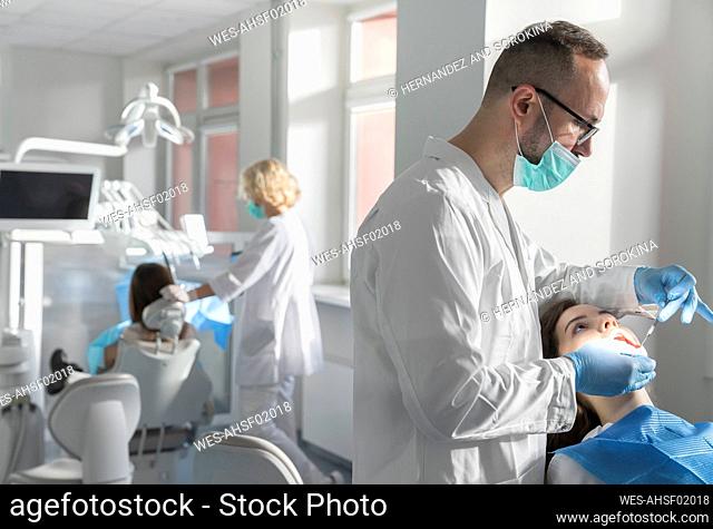 Young woman getting dental treatment in clinic