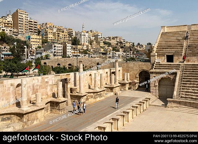 16 October 2018, Jordan, Amman: Visitors stand in the Roman theatre of Amman. This is an open-air theatre from the 2nd century AD. It had 6000 seats