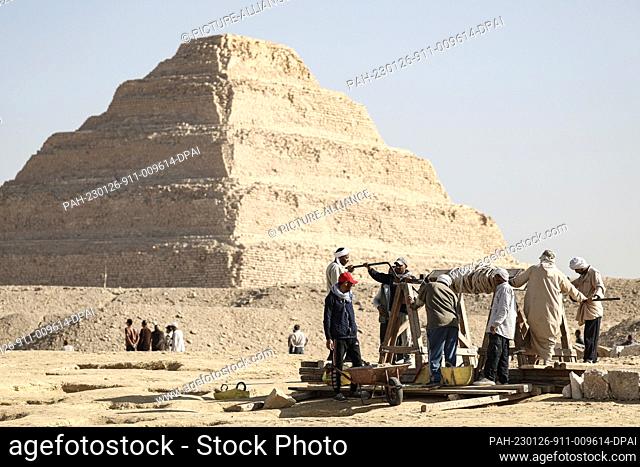 26 January 2023, Egypt, Giza: Egyptian antiquities workers dig at the site of the Step Pyramid of Djoser. Former Egyptian Minister of Antiquities