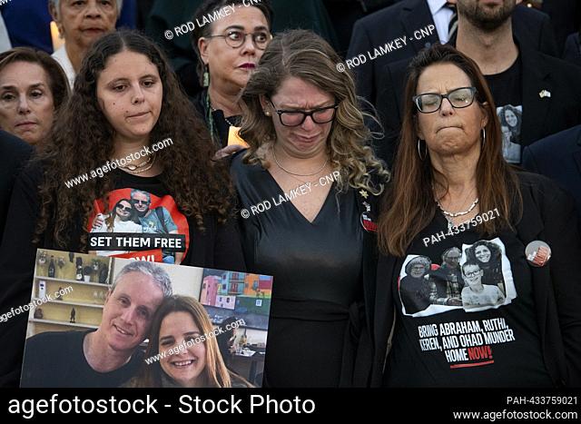 Shani Segal, center, fights back tears as Congressional Members are joined by family members of Israeli victims and Hamas hostages during a bipartisan...