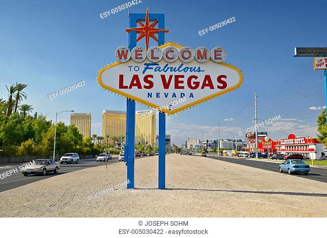 Colorful sign reads Welcome to Fabulous Las Vegas, Nevada in daytime with blue sky
