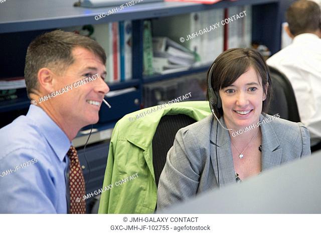 Astronauts Shane Kimbrough and Megan McArthur are pictured at the spacecraft communicator or CAPCOM console in the space station flight control room of the...