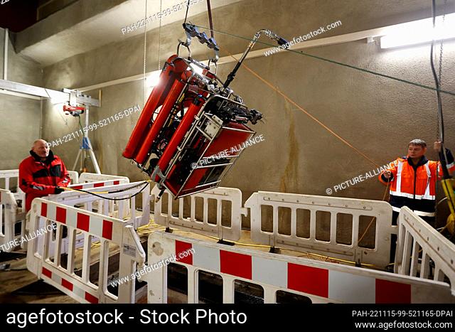 14 November 2022, Saxony-Anhalt, Thale: A diving robot is lowered into the dam via a shaft. Diving robots are being used to prepare the renewal of the bottom...