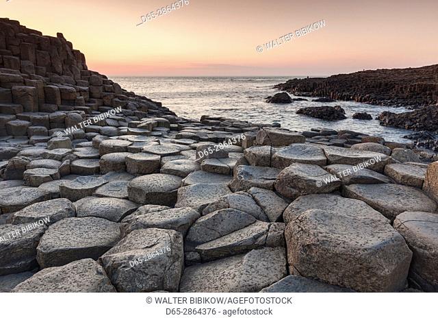 UK, Northern Ireland, County Antrim, Bushmills, Giants Causeway, Unesco World Heritage Site, coastal rock formation of basalt, dusk