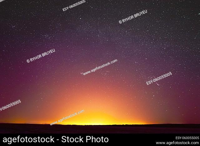 Colorful Night Sky With Glowing Stars Background Backdrop. Sky Gradient. Sunset, Sunrise Lights And Colourful Night Starry Sky In Yellow Pink Magenta Orange...