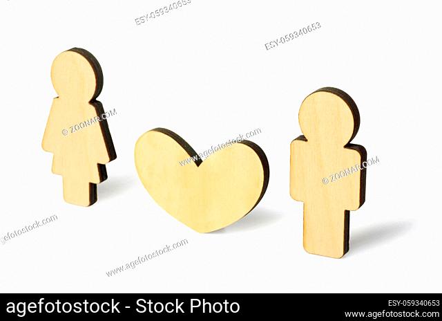 Wooden little man and woman with heart symbol of friendship, love and teamwork, isoalted on a white background