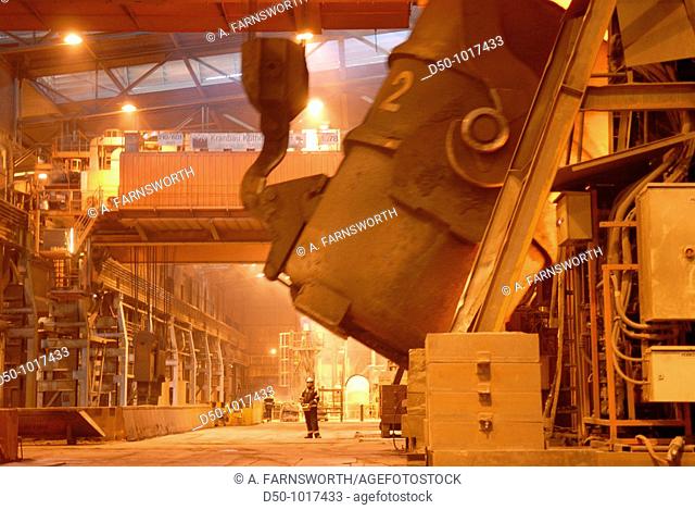 Man uses remote control to tip a huge vat of molten steel in steel making process, SSAB Swedish Steel Ab, Lulea, Sweden