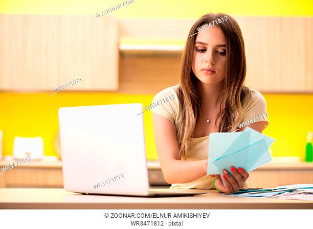 Young woman wife in budget planning concept