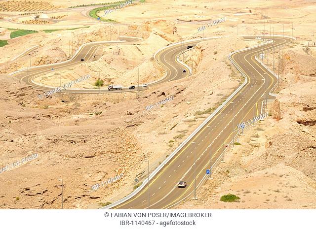 Serpentine road at the foot of Djebel Hafeet, the highest mountain in the United Arab Emirates, 1240 meters, in Al Ain, Abu Dhabi, United Arab Emirates, Arabia