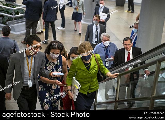 United States Senator Jeanne Shaheen (Democrat of New Hampshire) talks with reporters while walking through the Senate subway during a vote on amendments to H