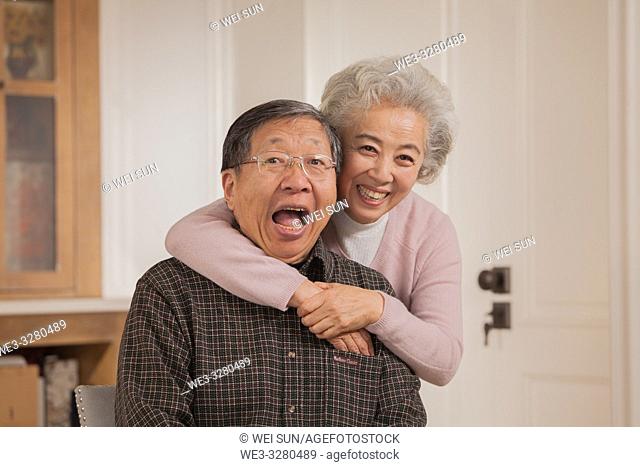 Portrait of loving old couple, Chinese ethnicity