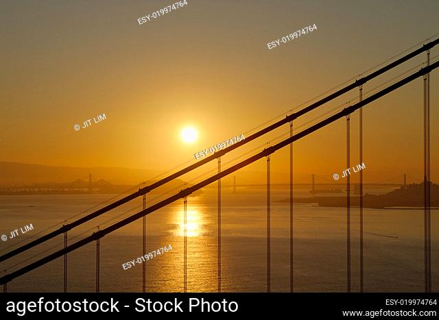 Sunrise over Golden Gate and Oakland Bay Bridge
