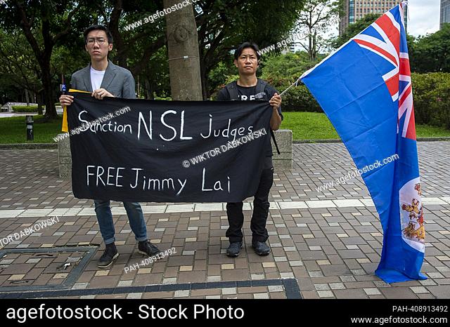 Pro-democracy activists for Hong Kong demonstrate in front of the building where Former British Prime Minister Liz Truss hold a press conference during her...