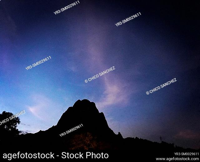 The Peña de Bernal monolite rock mountain at night in San Sebastian Bernal, Mexico