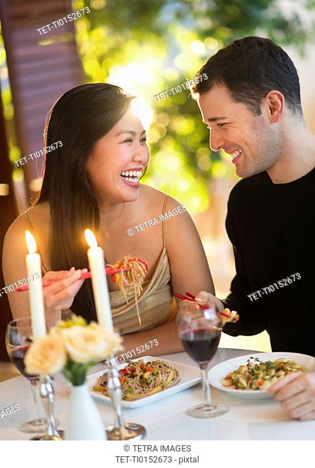 Couple enjoying fine meal in restaurant