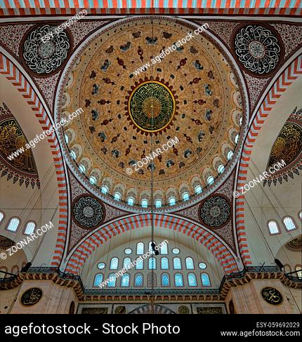 Decorated ceiling of Suleymaniye Mosque with main dome and intersection of three arches, Istanbul, Turkey