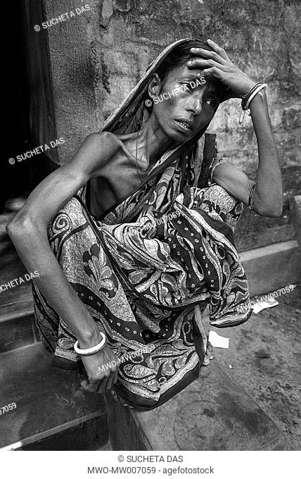 Sulata Roy Chowdhury, 50, sits in front of her house in disheartened look in Palta 90 km north of the eastern Indian city of Kolkata Roy Chowdhury said that she...