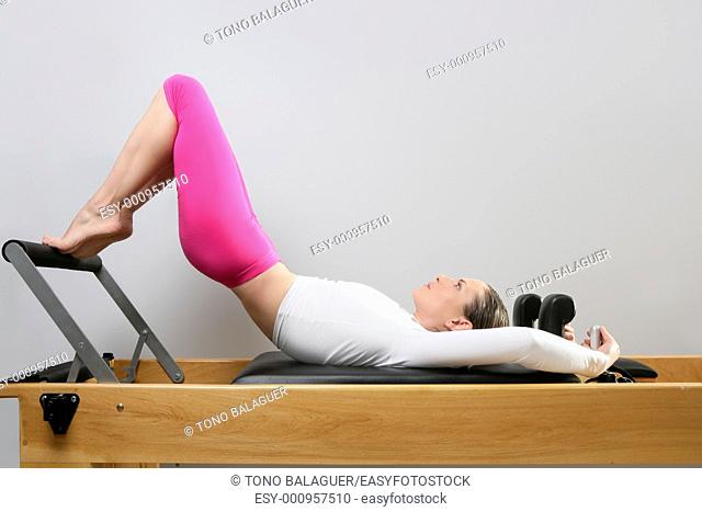 pilates reformer woman gym fitness teacher legs exercise