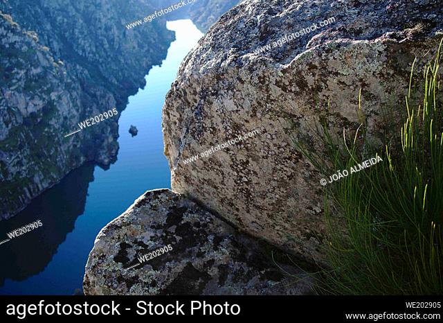 The Douro river slowly flowing in the narrow cliffs by the Mirandese Plateau