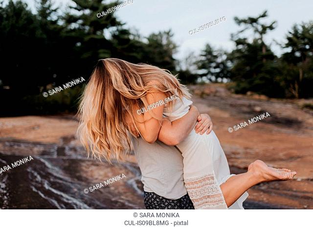 Couple hugging in Algonquin Park, Canada