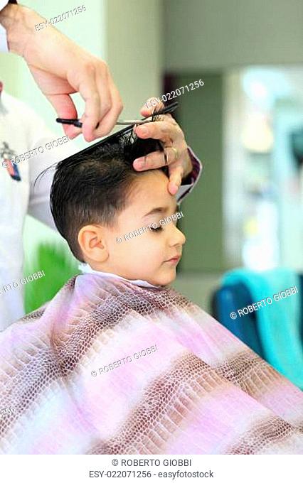 Lovely child at hairdresser