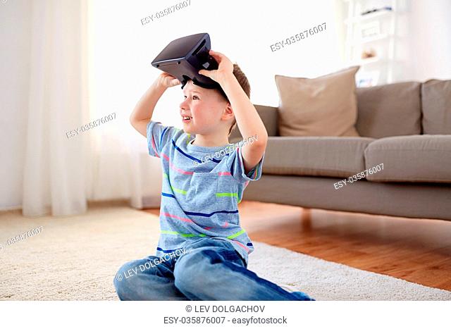 little boy in vr headset or 3d glasses at home