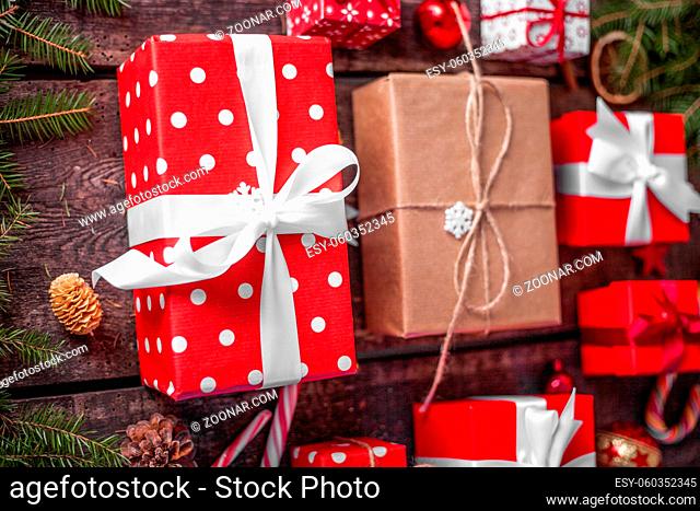 Gift box in wrapping paper with satin ribbon. Merry Christmas holiday concept