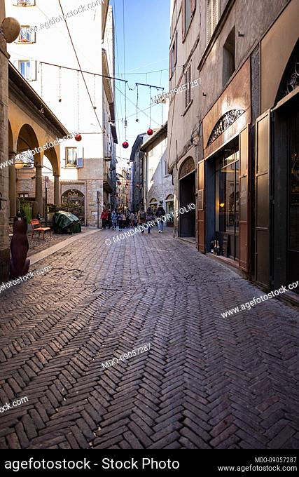 Via Gombito: main street with shops in the historic center of the upper city. Bergamo (Italy), December 3rd, 202