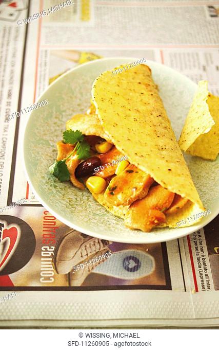 Tacos filled with chicken, sweetcorn and beans