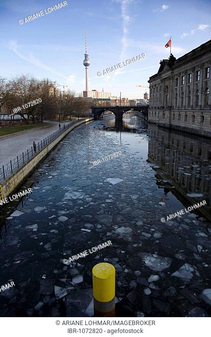 View towards the Fernsehturm television tower, Monbijou Park and the Bode Museum over the Spree River, with ice floes in winter, Berlin Mitte, Germany, Europe