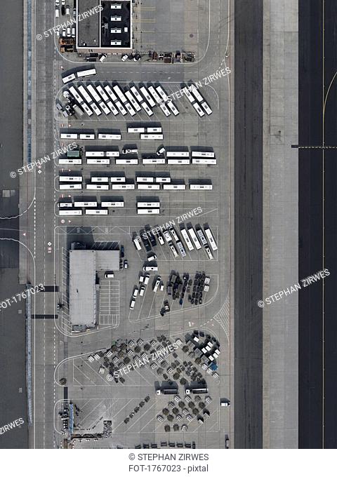 Aerial view buses and cars parked at airport
