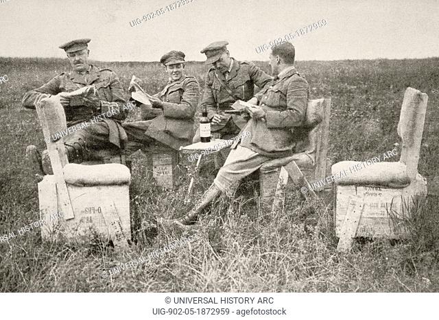 Officers of a British artillery unit relax behind the lines on homemade furniture during the First World War. From L'Illustration, 1916