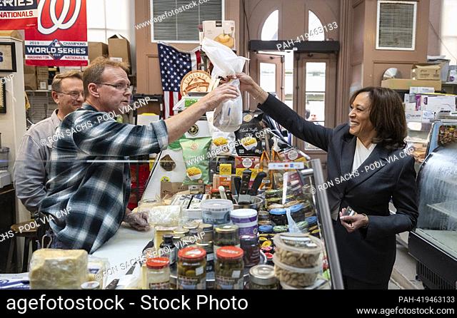United States Vice President Kamala Harris purchases cheese at Bowers Fancy Dairy Products Stand No. 400, a retail establishment located in the Eastern Market...