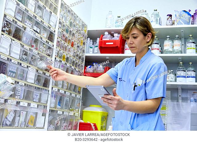 Nurse with a tablet in the pharmacy, Hospital Donostia, San Sebastian, Gipuzkoa, Basque Country, Spain