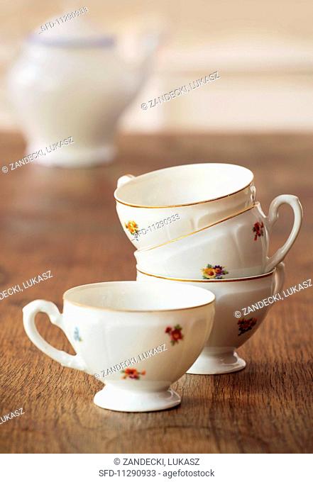 A stack of floral-patterned tea cups