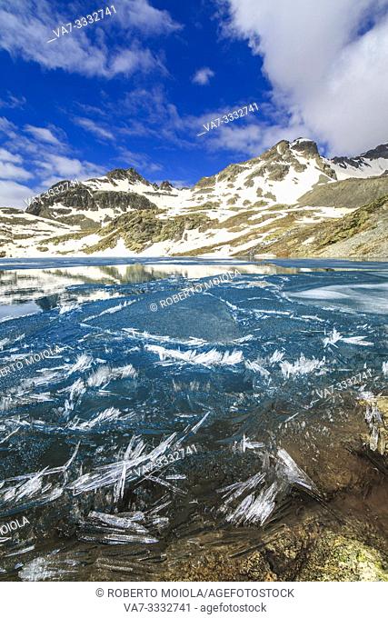 Ice crystals on surface of Lej da la Tscheppa during spring thaw, St. Moritz, Engadin, canton of Graubunden, Switzerland