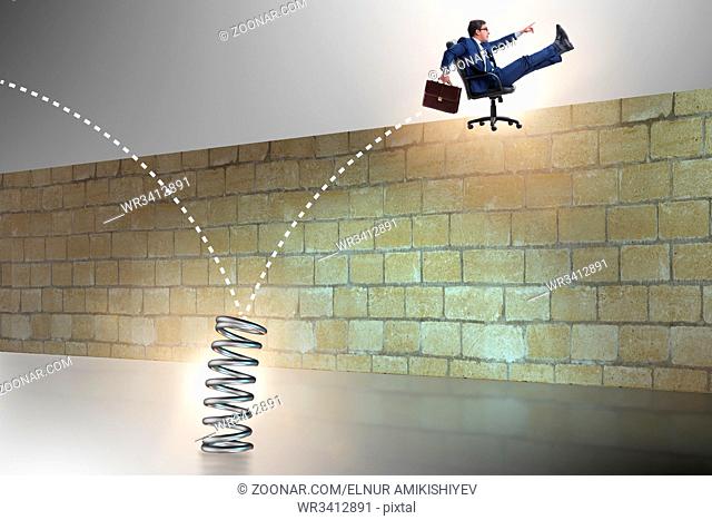 Businessman jumping from spring in business concept