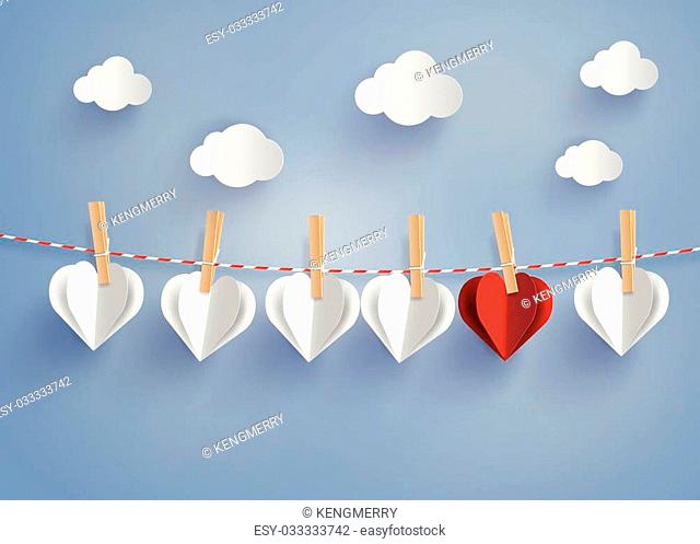paper heart shape hanging on the lope with blue sky.paper art style