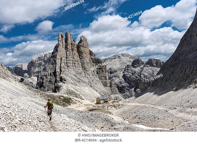 Rosengarten group, descent from Santner-ferrata, Gartlhütte in front, climbing rock Vajolet Towers behind, 2821 m, Dolomites, UNESCO World Heritage Site, Alps