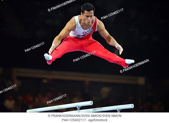 Eddy YUSOF (SUI) action on the parallel bars. Men`s Team Final, Men's Team Final on 09.10.2019. Gymnastics World Championships 2019 in Stuttgart from 04