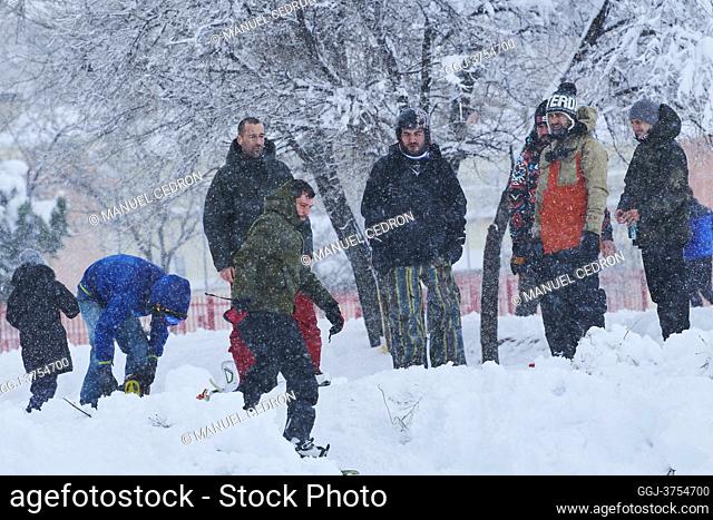 People playing with snowboard in a residential area of Mostoles on January 9, 2021 in Madrid. Spain is on red alert for a second day due to storm Filomena
