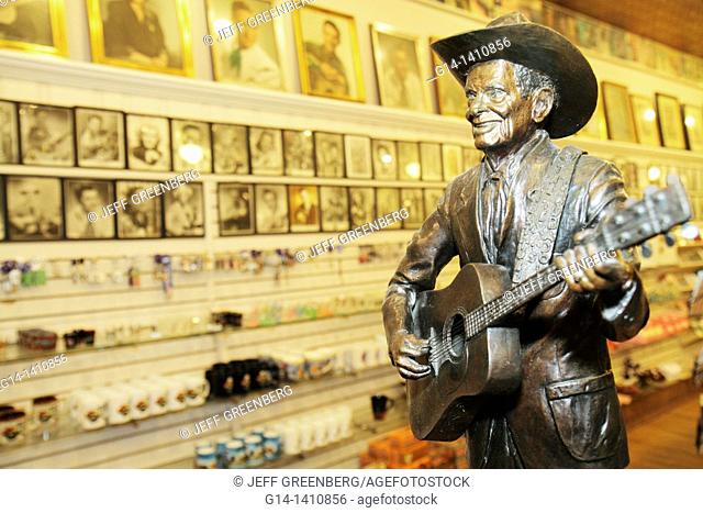 Tennessee, Nashville, 'Music City USA', downtown, Lower Broadway, business strip, Ernest Tubb Record Shop, shopping, country music, man, CDs, books, statue