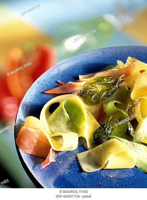 Tagliatelles with avocado, raw ham and fried basil leaves