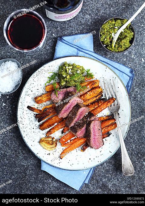 Roasted lamb with carrots and pesto