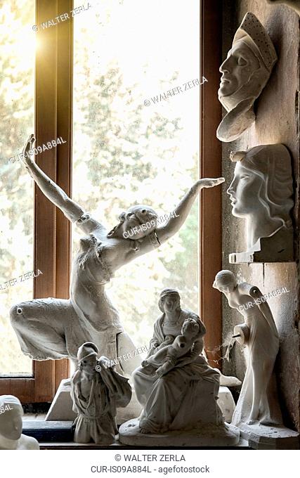Sunlight through window onto sculptures in artist's studio