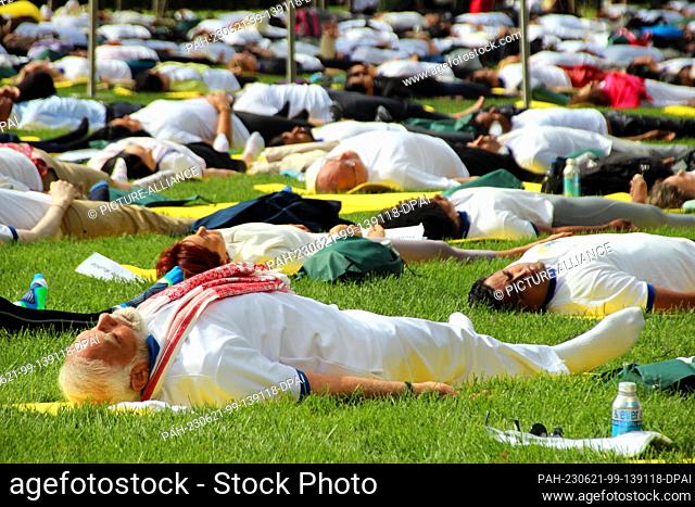 21 June 2023, USA, New York: Narendra Modi (front), prime minister of India, practices yoga with hundreds of people at the United Nations
