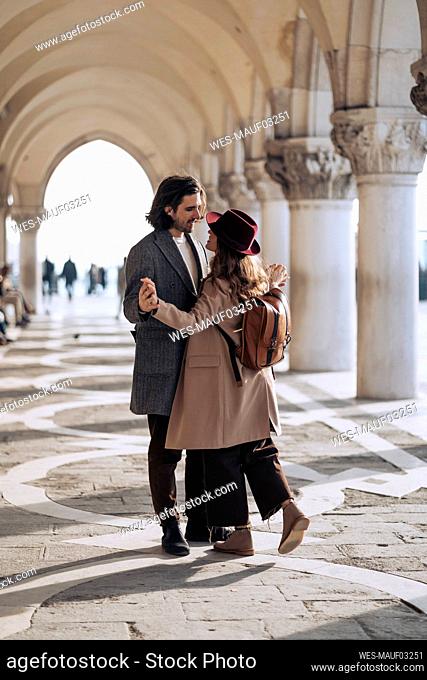 Affectionate young couple in the city of Venice, Italy