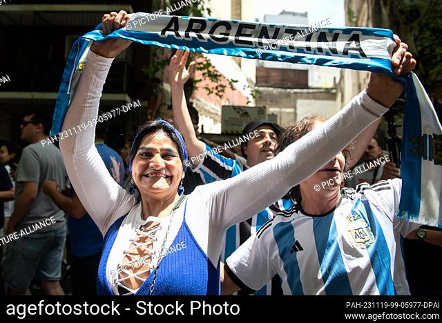 19 November 2023, Argentina, Buenos Aires: Supporters of libertarian populist Javier Milei cheer at the Almagro campus of the National Technological University
