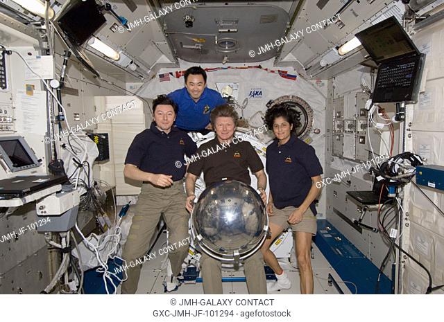 Four of the six Expedition 32 crew members pose for a photo with a small ball-shaped science satellite in the Kibo laboratory of the International Space Station